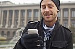 Man With Mobile Phone In Hands Stock Photo