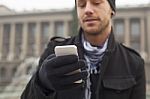 Man With Mobile Phone In Hands Stock Photo