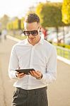 Man With Mobile Phone In Hands Stock Photo