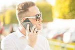 Man With Mobile Phone In Hands Stock Photo