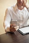 Man With Smartphone In Office Stock Photo