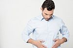 Man With Strong Stomach Pain Stock Photo