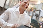 Man With Tablet Computer Smiling Stock Photo