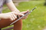 Man With Tablet Reading News And Communicate On Social Networks Stock Photo