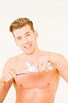 Man With Toothbrush And Toothpaste Stock Photo