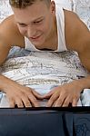 Man Working On His Personal Laptop Stock Photo