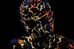 Man's  Face Painted In Neon Uv Lava Stock Photo