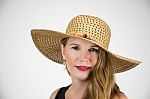 Mature Blonde Female In Large Hat Smiling And Looking At Camera Stock Photo