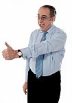 Mature Businessman With Thumbs Up Stock Photo