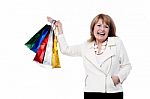 Mature Woman With Shopping Bags Stock Photo