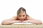 Matured Woman Lying On Mat Stock Photo