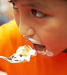 Messy Kid Eating Cream Cake Dessert Stock Photo