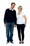 Middle Aged Couple Posing With Hand In Hand Stock Photo