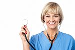 Middle Aged Female Doctor With A Stethoscope Stock Photo