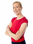 Middle Aged Lady With Folded Arms Stock Photo