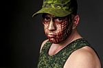 Military Style Camouflage On The Soldier's Face Stock Photo