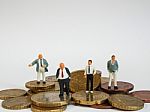 Miniature Businessman Stand On Euro Coins And Book Bank. Busines Stock Photo