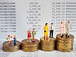 Miniature Family Stand On Pile Of Euro Coins And Book Bank. Fami Stock Photo