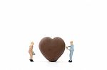 Miniature Worker Making Heart Shaped Chocolate On White Background , Stock Photo