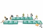 Miniature Worker Team Building Word Happy New Year On White Background Stock Photo