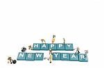 Miniature Worker Team Building Word Happy New Year On White Background Stock Photo