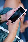 Mobile Phone In A Woman's Hand In The City At Night Stock Photo