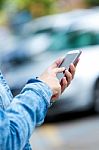 Mobile Phone In A Woman's Hand. Outdoor Image Stock Photo