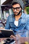 Modern Young Man With Digital Tablet In The Street Stock Photo