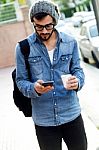 Modern Young Man With Mobile Phone In The Street Stock Photo