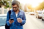 Modern Young Man With Mobile Phone In The Street Stock Photo