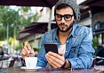 Modern Young Man With Mobile Phone In The Street Stock Photo