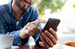 Modern Young Man With Mobile Phone In The Street Stock Photo