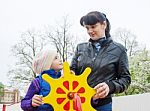 Mom Plays With Her Daughter On A Toy Ship Stock Photo