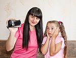 Mom Showing Her Little Daughter Where Babies Come Stock Photo