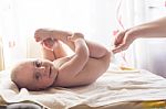 Momy Cleaning Baby Skin With Wet Wipes Stock Photo