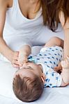 Mother And Baby Playing And Smiling At Home Stock Photo