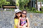 Mother And Daughter Enjoying The Summer Outdoors With Fancy Sung Stock Photo