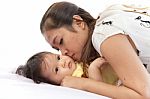 Mother And Her Baby In Action On White Background Stock Photo