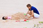 Mother And Son Are Playing On Tropical Beach Stock Photo