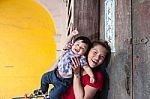 Mother And Son Standing At The House Stock Photo