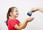 Mother Gives The Purse To A Little Girl Stock Photo