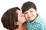 Mother Kissing Her Son Stock Photo