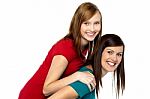 Mother Piggybacks Her Teenage Girl Stock Photo