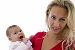 Mother With Her Baby Looking At Camera Stock Photo