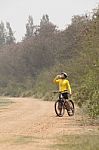 Mountain Bicycle Man Drinking Fresh Water From Bottle On Dirt Track Stock Photo