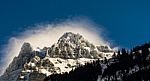 Mountain Peak With A Halo Of Cloud Cover Stock Photo