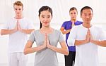 Multi Ethnic Group Of Happy People Doing Yoga Stock Photo