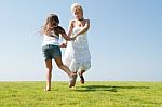 Mum And Daughter Playing in garden Stock Photo