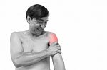 "muscle Strain"  Old Aged Thai Man Grasp His Arm. And Blank Area Stock Photo