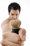 Muscular Man Holding Wooden Stick Stock Photo